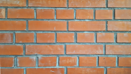 Beautiful flat wall of red brick, texture or background, closeup.の写真素材