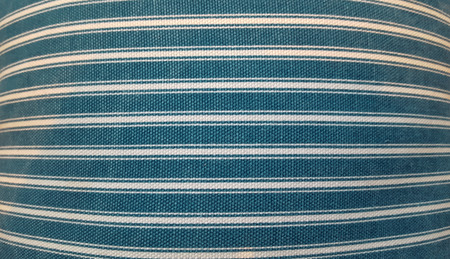 Texture of a fabric of a pillow, sofa, bed, background. Close up, striped, blue and white horizontal linesの写真素材