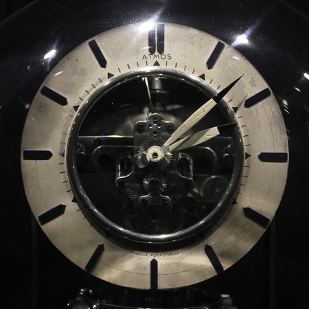 Old vintage antique clock on black background.の写真素材