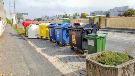 Czech Republic, Prague - September 21, 2017: Color containers for separate collecting garbage. Sunny summer day.のeditorial素材
