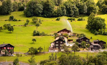 Summer view of alpine chalets in Switzerland. Beautiful outdoor scene in Swiss Alps