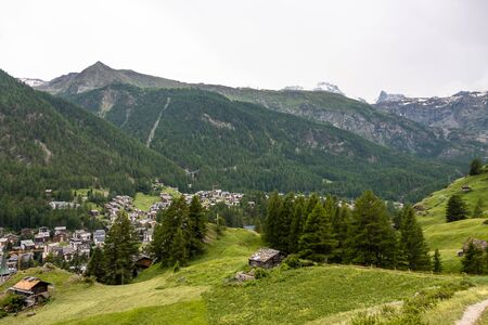View of resort Zermatt on Alpine valley landscape, mountain, green meadow.の写真素材