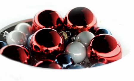 Heap of Christmas balls red, blue and light on a white background.の写真素材