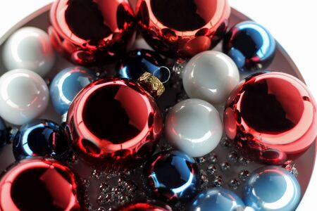 Heap of Christmas balls red, blue and light on a white background.の写真素材