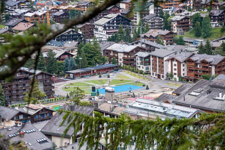 Elevated view of public space with palyground an alpine resortの写真素材