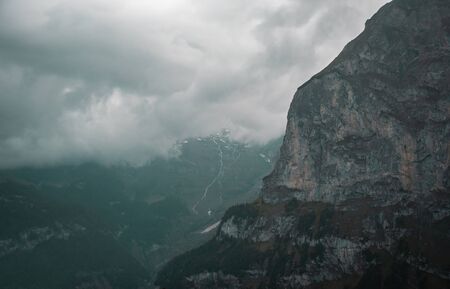 Gloomy dramatic mountain landscape. Atmospheric highland scenery in bad cloudy weatherの写真素材