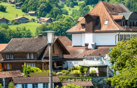 Lamppost on the background of houses. Swiss commune, village.の写真素材