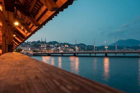 Kapellbrucke historic wooden bridge in Luzern and cityscape, town in central Switzerland