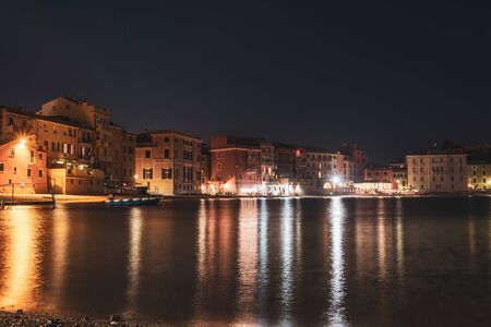 Panoramic night view of beatiful sea resort town. Romantic vacation. Italy, Sestri Levante, Bay of Silenceの写真素材