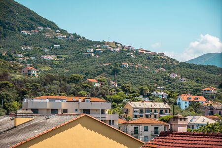 Top view of a street with low houses with red tiles. green Street. hill view.の写真素材