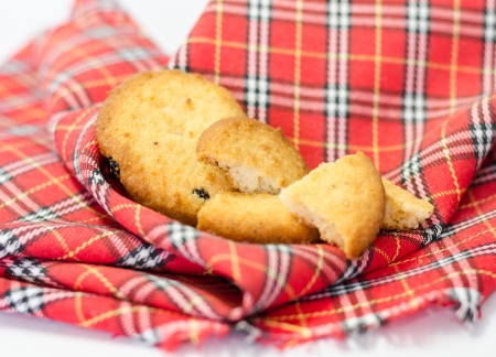 Raisin cookies and cracked raisin cookies on red tartan dishtowelの写真素材