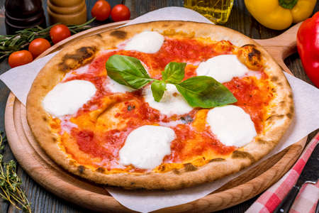 Italian pizza Margherita buffalo with tomato sauce and basil top view