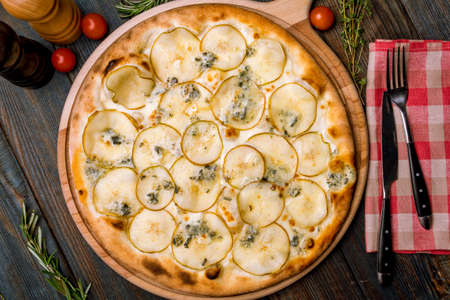 Pizza with pears and Gorgonzola cheese. top viewの写真素材