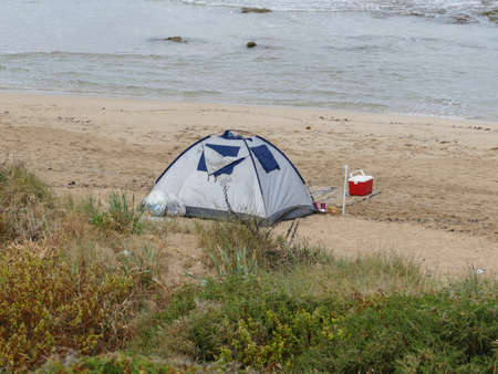 peaceful camping in tents along the shore,の写真素材