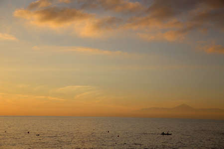kayaking at sunset with a volcano in the background, Teide, Canary Islandsの写真素材