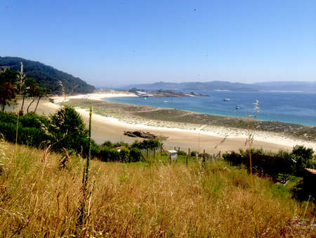 beautiful wild beach panorama. White sand and blue water. Islas CÃ­es, Galicia, Spainの写真素材