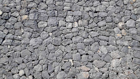 volcanic grey stone wall background full lengthの写真素材