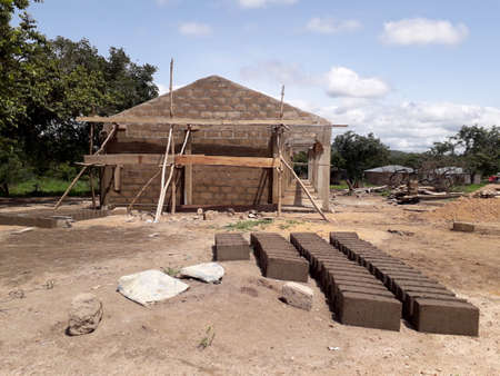 school building under construction in an undeveloped country in Africa. Developing countries and relief work context. School for african children.の写真素材