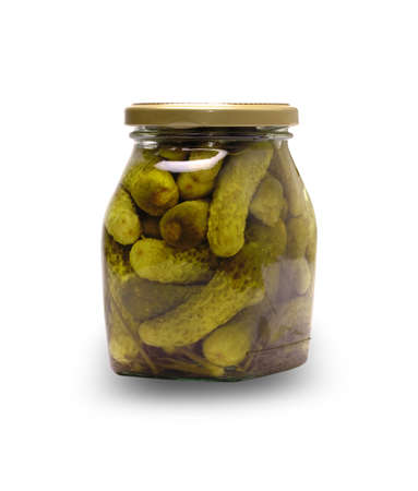 Pickled cucumbers in glass jar on the white backgroundの写真素材