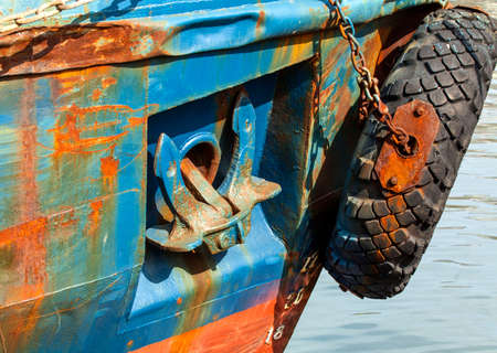 the lifted anchor onboard the old rusty vesselの写真素材
