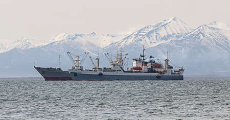 fishing trawler in the Bay on the roads in Kamchatkaの写真素材