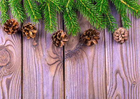 Christmas wooden background with  fir tree. Top view with copy space