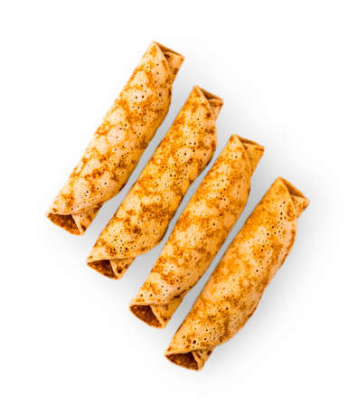 delicious pancakes rolled in a roll on white backgroundの写真素材