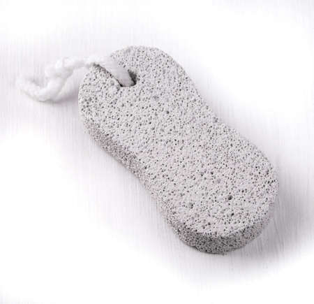 white pumice stone with rope on the white wooden tableの写真素材