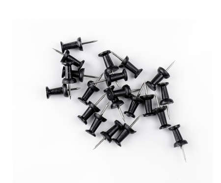 Close-up of many black pins on white background. Top viewの写真素材
