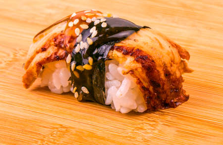 Fresh appetizing seafood sushi on wooden tableの写真素材