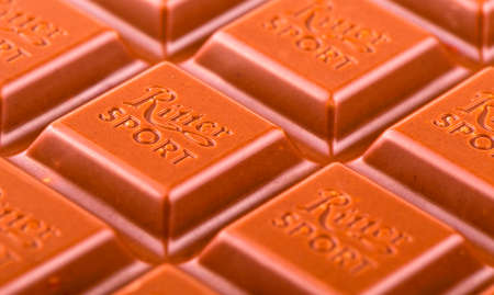 Russia, Kamchatka- July 11, 2017: Ritter Sport milk chocolate bar macro. Ritter Sport chocolate bar made by Alfred Ritter GmbH & Coのeditorial素材