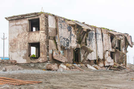 Ruined house on the sand near the sea