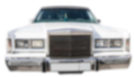 blur of front view of old white car