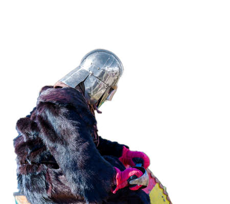 medieval knight in a fur Cape wearily sad after the battle on white backgroundの写真素材