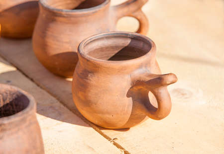 vintage pottery on wooden surfaceの写真素材