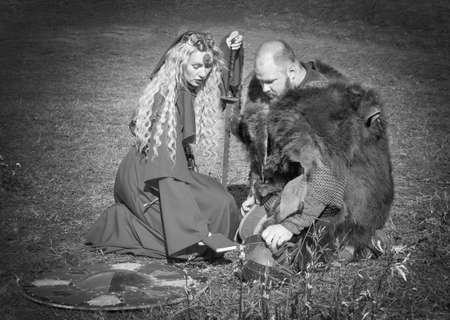 Russia, Kamchatka - OCTOBER,  01, 2017: The first Kamchatka military historical festival in the city of Petropavlovsk-Kamchatsky. Woman in  medieval clothes and the knightのeditorial素材