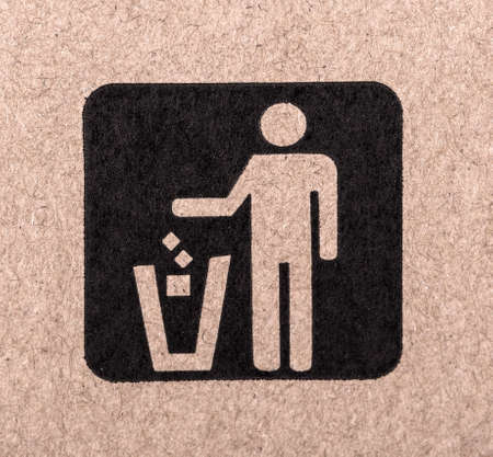 figure of person throwing garbage into a trash canの写真素材