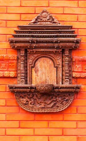 beautifull  pattern on a red brick wall of a public Buddhist temple in Chinaの写真素材