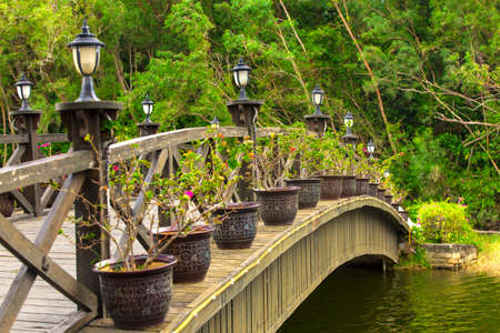 Beautiful wooden bridge across riverの写真素材