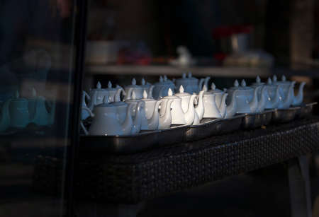 teapots with hot tea in the restaurant before openingの写真素材