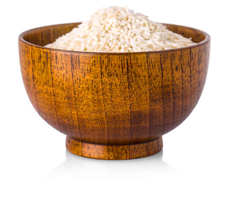 Rice in wooden bowl on white background. Close up, high resolution product.の写真素材