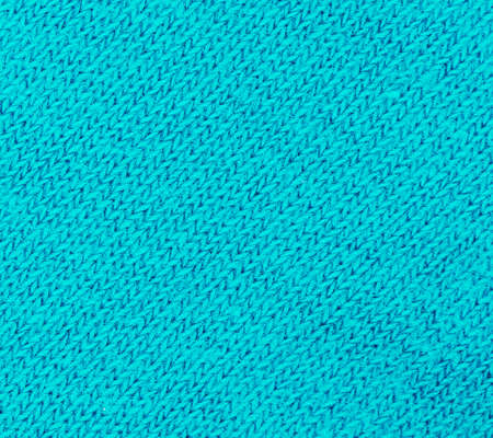 Green knitted fabric texture abstract backgroundの写真素材