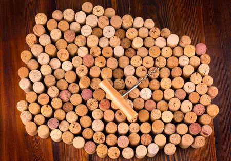  bottle of wine with corks on wooden table background.
