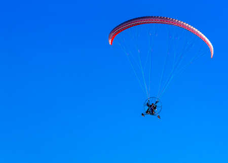 the sport paramotor and blue sky on Kamchatka, Russiaの写真素材