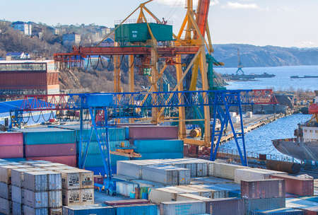 Kamchatka, Russia - 10 NOV 2015: Set of containers and cranes in seaport on Kamchatka in November