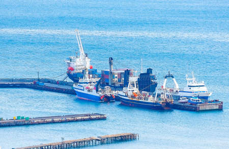The ships near the pier in the seaport on Kamchatka