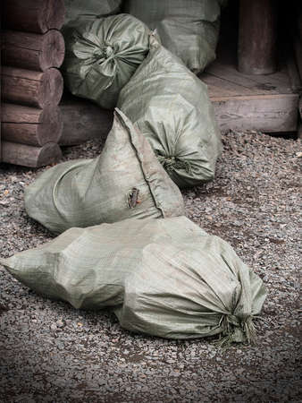The bags of trash at the entrance in a wooden houseの写真素材