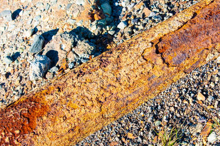 Fragments of old cast-iron water pipeの写真素材