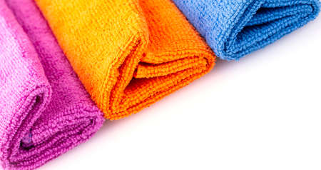 Stack of color microfiber cloths isolated on white backgroundの写真素材