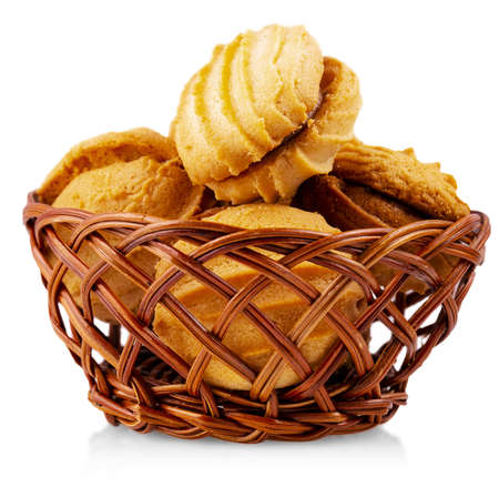 wicker vase with cake isolated on white backgroundの写真素材